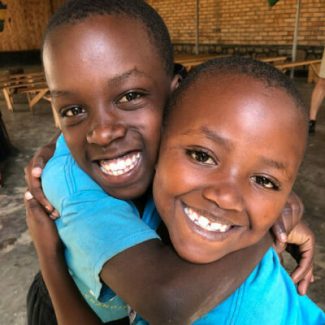 Acts4Rwanda Sponsor Girls Hug